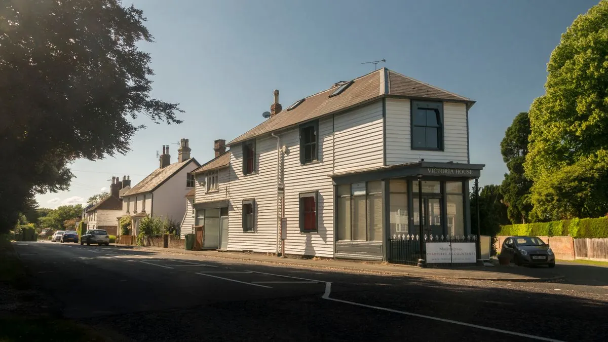 Hawkhurst village with traditional white weatherboard cottages, Kent