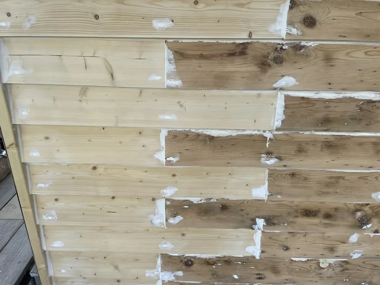 Bare weatherboards stripped and filled by hand on Angela Cottage, Cranbrook — preparation detail