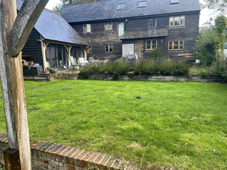Replacement weatherboards being fitted and filled on a barn conversion at The Moor, Hawkhurst