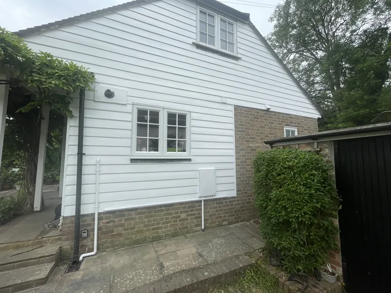 Completed weatherboard repaint on a Cranbrook cottage with a clean, even finish