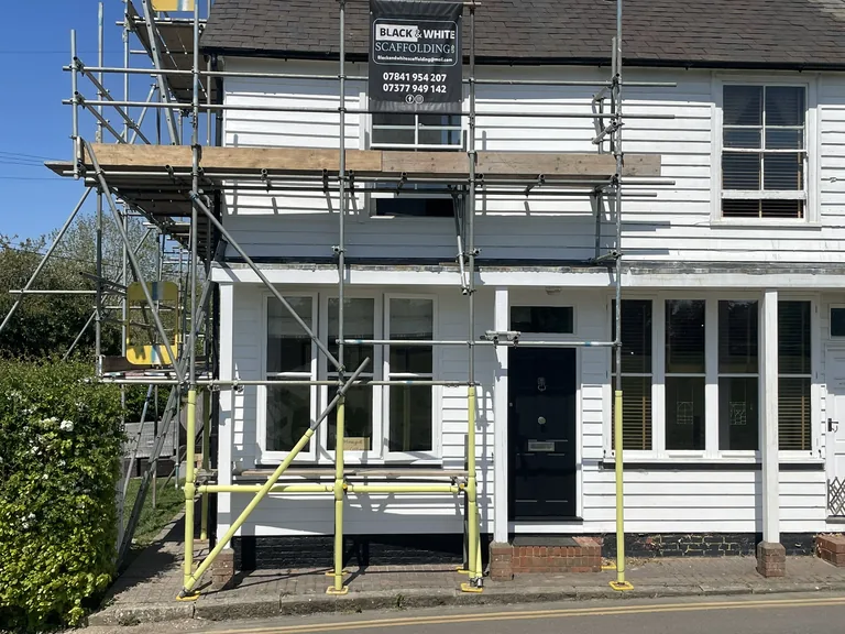 Replacement flat-roof fascia board matched to existing on a listed property in Hawkhurst