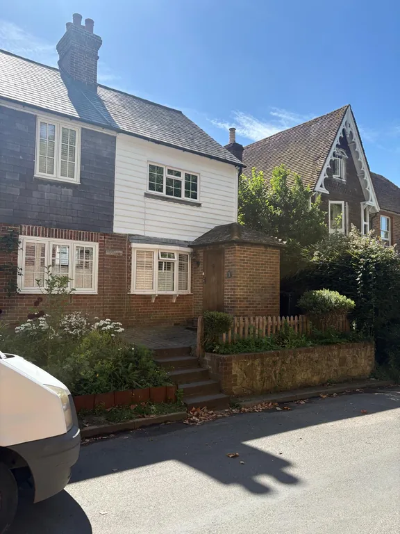 Completed weatherboard restoration on a period cottage in the village of Fletching, East Sussex