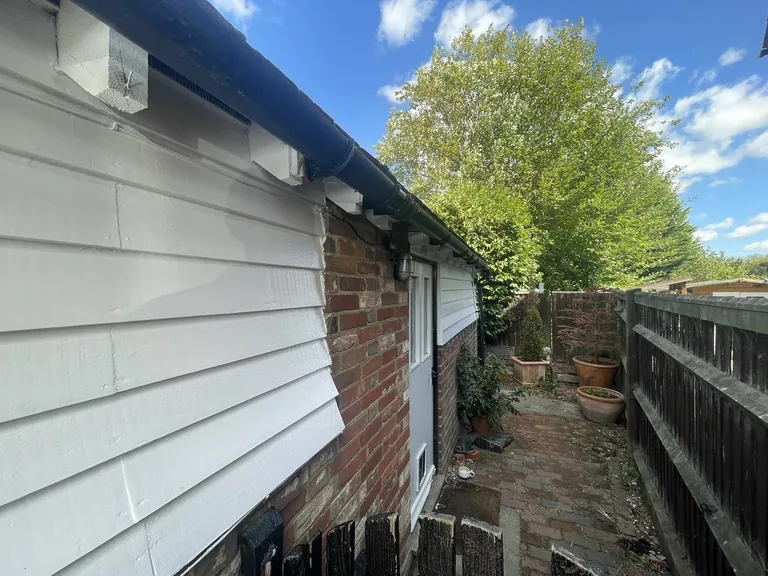 Corrected and re-supported gutter run around the curved wall in Mountfield