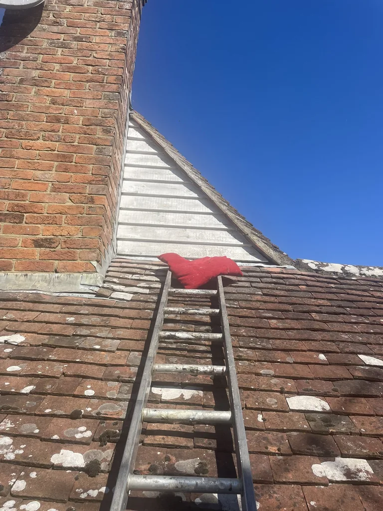 Rear apex and bargeboards before preparation and repainting in Mountfield