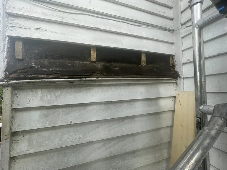 Failed weatherboards removed ready for replacement on a Mountfield cottage