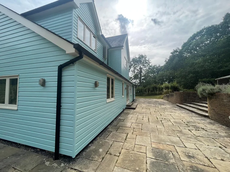 Completed side elevation after extensive weatherboard repairs and repainting in Biddenden