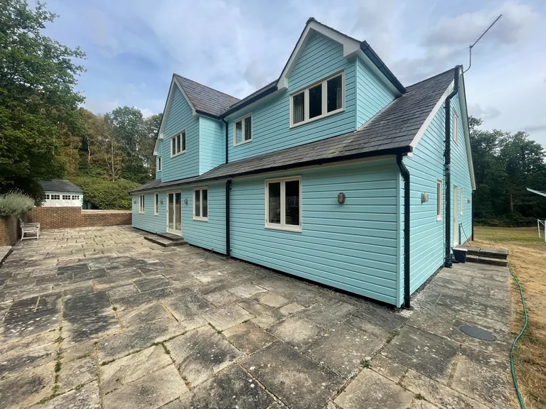 Three quarter view of restored timber weatherboarding in Biddenden