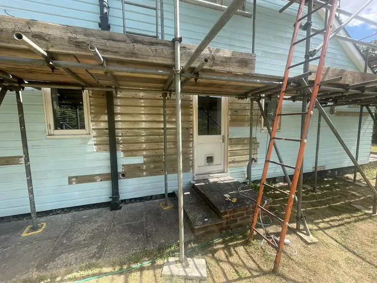 Treated shiplap weatherboards being installed during a large restoration project in Biddenden